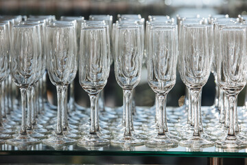 Empty glass transparent wine glasses on a table, catering background concept