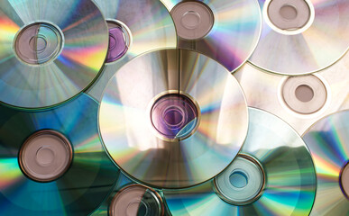 Background of compact discs. Vintage Technology from the 90s.