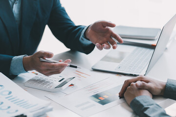 Business team collaboration discussing working analyzing with financial data and marketing growth report graph in team, presentation and brainstorming to strategy planning making profit of company.