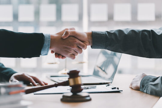 Lawyer business women shaking hands with clients, after finishing up a Consulting for insurance rent house. concept of home protection, family, insurance. - Powered by Adobe