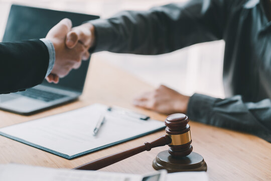 Lawyer business women shaking hands with clients, after finishing up a Consulting for insurance rent house. concept of home protection, family, insurance.