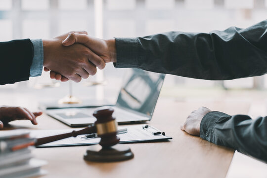 Lawyer business women shaking hands with clients, after finishing up a Consulting for insurance rent house. concept of home protection, family, insurance.