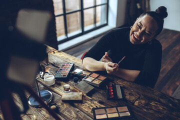 Fototapeta premium A woman does makeup live. High quality photo