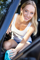 closeup picture image young woman driver dry wiping her car