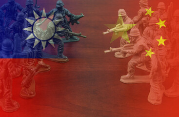 War or military conflict between China and Taiwan concept. Two groups of toy soldiers with flags of...