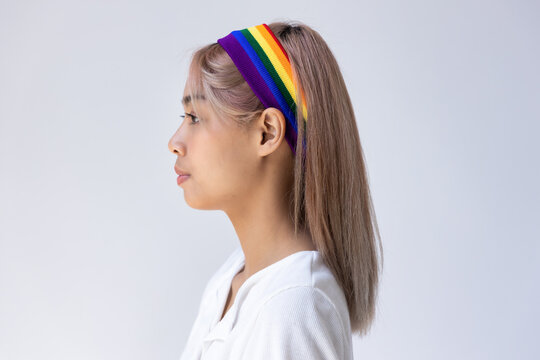 side face portrait of non-binary LGBT woman on isolated background