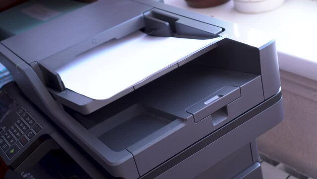 multifunctional device that combines the functions of a printer, scanner, fax device, copy module. scanning images from sheets of paper