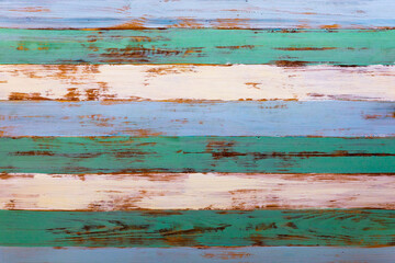 Closeup top view shot of blue green and brown colors old rough texture aged vintage retro wooden material stripe pattern tabletop board desk background. Floor structure hardwood surface wallpaper