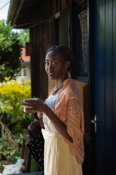 Portrait of young African woman with a cup of tea
