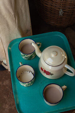 plastic tray with tea cups and tea pot 