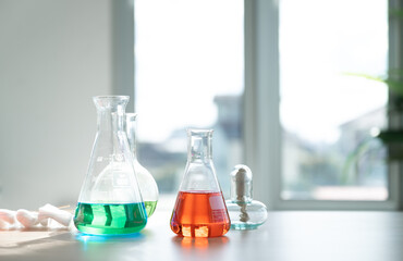 Copy space science glassware with window background 