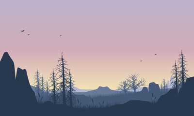 Gorgeous mountain view with the realistic silhouette of dry pine trees at dusk