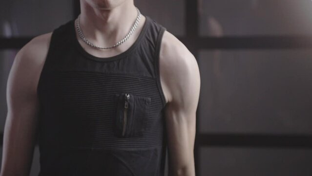 Cropped View Of A Man In Black Sando Doing Arm Workout With A Dumbbell At Home. - Medium Closeup