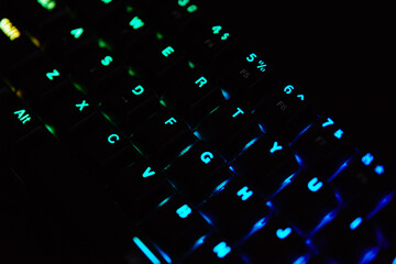Gaming keyboard, close up. Mechanical rgb keyboard for computer games on dark backgound