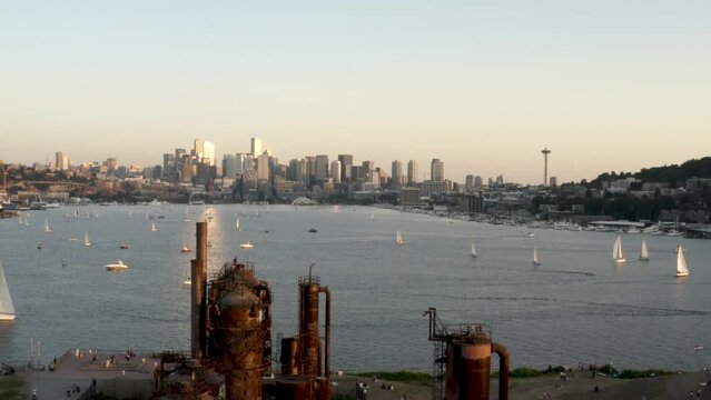 Aerial view pushing over Gas Works Park towards Lake Union and the Seattle city skyline.
