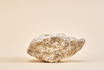 Natural granit stone on beige background, minimal product podium - obrazy, fototapety, plakaty