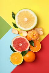 Different citrus fruits on multi color background