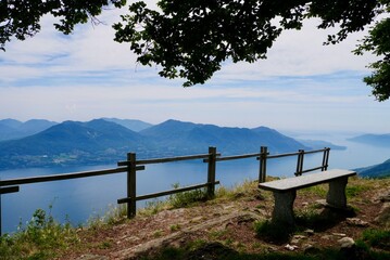 Bench on top of Cima di Morissolo overlooking lake Maggiore. Lombardy, Italy.
