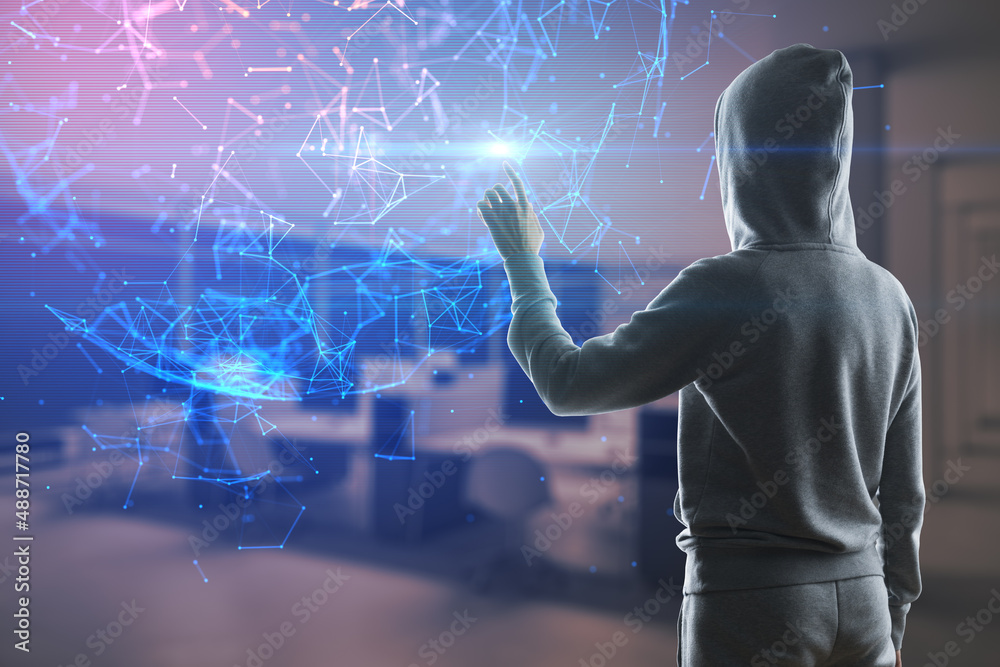 Poster hacker in hoodie pointing at abstract glowing polygonal sphere on blurry office interior background.