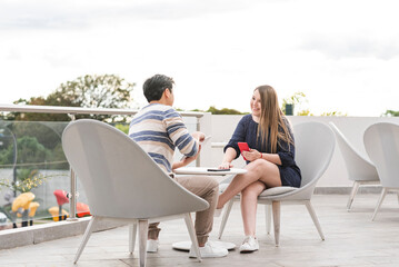 couple having a pleasant conversation on an outdoor terrace