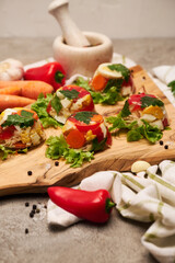 Portion of delicious chicken aspic on serving board on concrete table