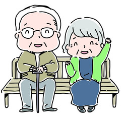 ベンチに座っているおじいさんとおばあさん