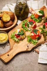 Portion of delicious chicken aspic on serving board on concrete table