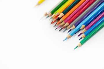 blunt colour pencils are arranged in the line on the white background and ready to paint.