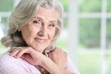 Fototapeta na wymiar Portrait of beautiful senior woman posing at home