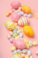 Fototapeta na wymiar Top view shot of arrangement decoration Happy Easter holiday background concept. Flat lay colorful bunny eggs with ornament on pink paper, Design pastel tone. Banner, flyer, greeting card
