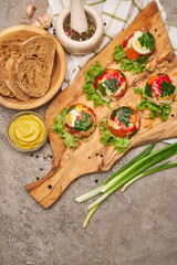 Portion of delicious chicken aspic on serving board on concrete table
