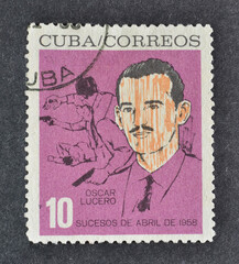 Cancelled postage stamp printed by Cuba, that shows portrait of Oscar Lucero, circa 1964.