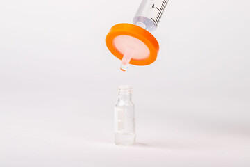 Scientist demonstrating the use of needle tip filters in a laboratory setting.