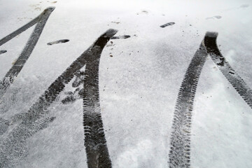 Tyre tracks on snow road.