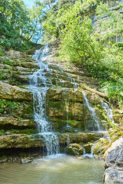 Mountain waterfall in the forest, a large noisy stream of water © Fotoproff
