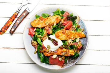 Healthy salad of chicken meat and grapefruit