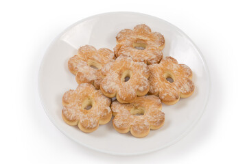 Shortbread cookies in shape of flower sprinkled with powdered sugar