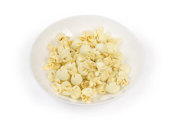 Uncooked frozen meat dumplings original shape in the white bowl