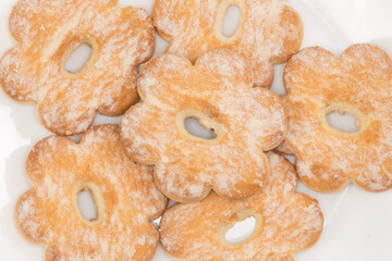 Shortbread cookies sprinkled with powdered sugar, fragment top view