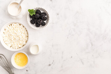 Ingredients for making curd berry dessert. Top view.