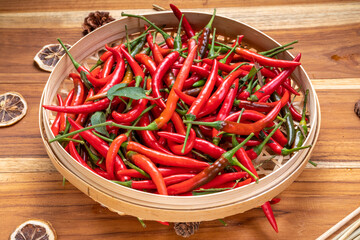 Red hot chili peppers on bamboo basket, Red chilli for hot and spicy Thai cooking food.
