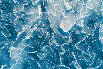 Aerial top down view of ice surface. Frozen sea surface texture