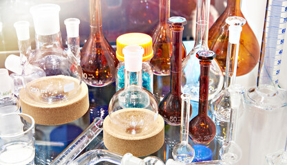 Laboratory glass bottles and flasks in store