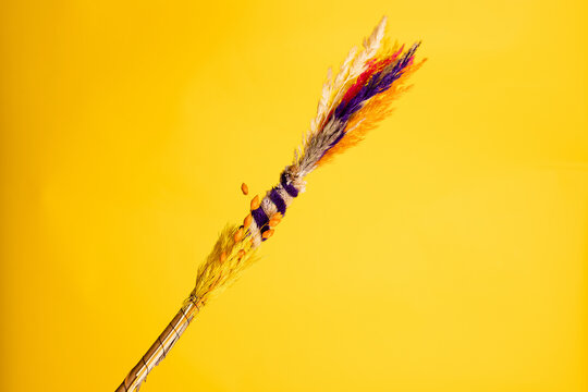 Colorful Easter palm on a yellow background. Traditional Christian decoration for Palm Sunday, banner with a copy space.