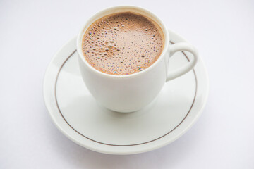 close-up of coffee cup full of coffee and white background. hot fresh turkish coffee