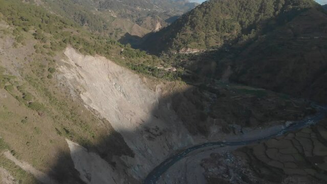 revealing mountains, river, valley, blue sky in Kabayan benguet Philippines Aerial reverse and panning up