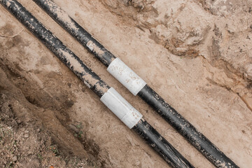 Repair of the water line of the heating main pipe in the ground trench pipeline at the construction...