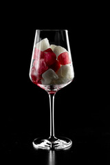glass with raspberry and white ice