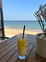 Drinking coctail in the restaurant on the beach with sea view