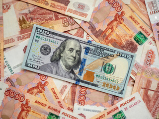 US Dollar and Russian ruble. Money background. Currency exhange. Economic crisis. Rouble dollar cash. Hundred dollar bill and 5000 rubles. Business and finance. Russia and USA